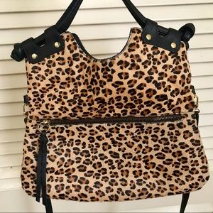 Calf hair leopard purse with leather accents.